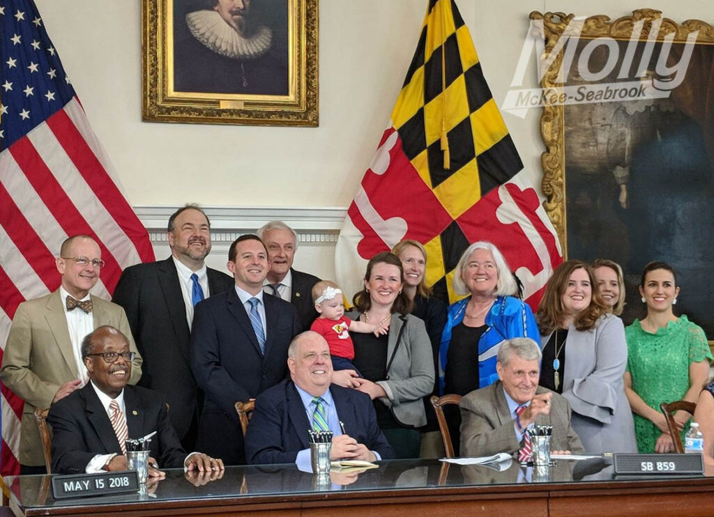 Molly with her oldest daughter Sybil at the bill signing for state employee parental leave in 2018.
